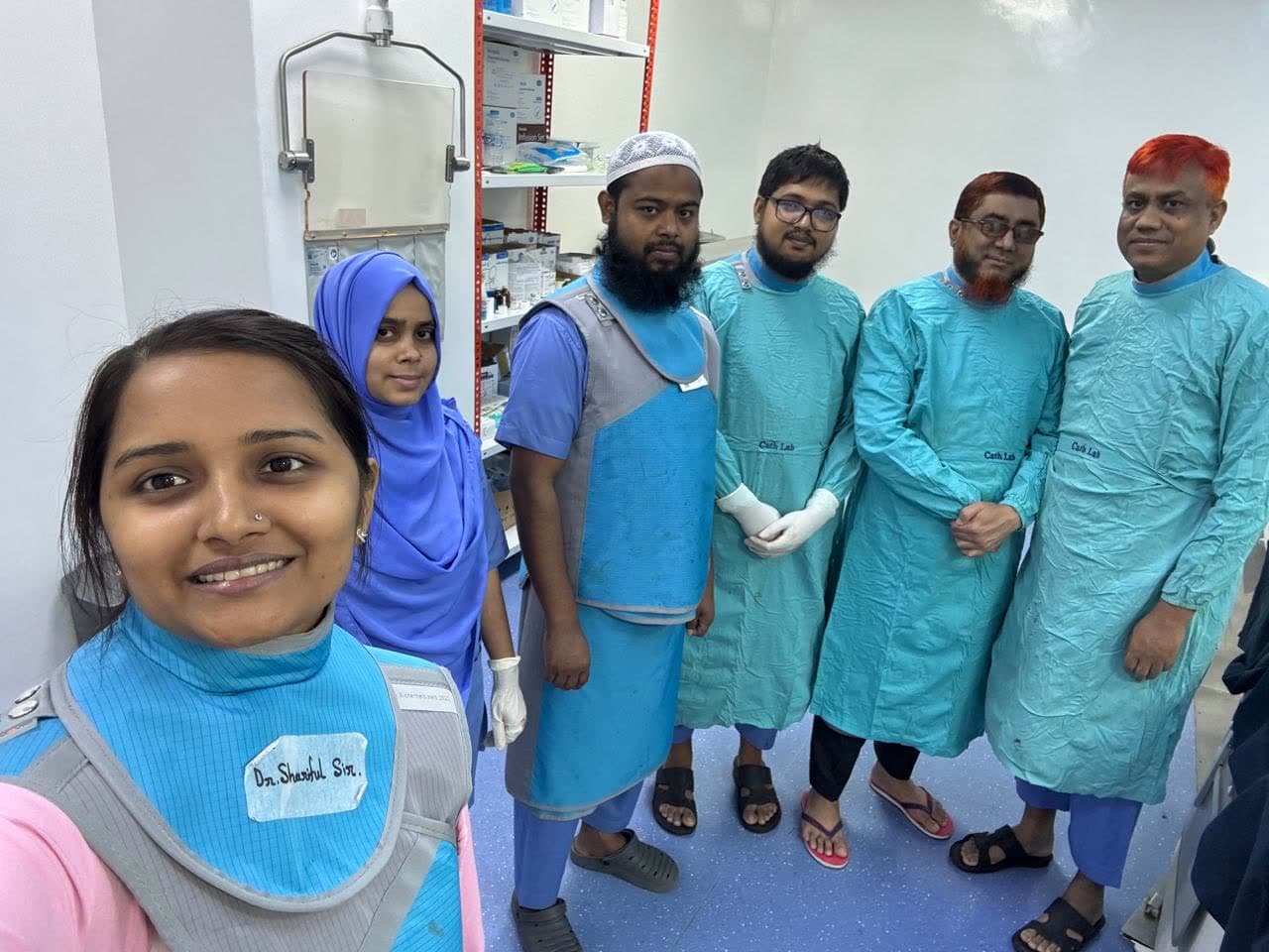Dr. Md. Shariful Islam with the cardiac catheterization laboratory team
