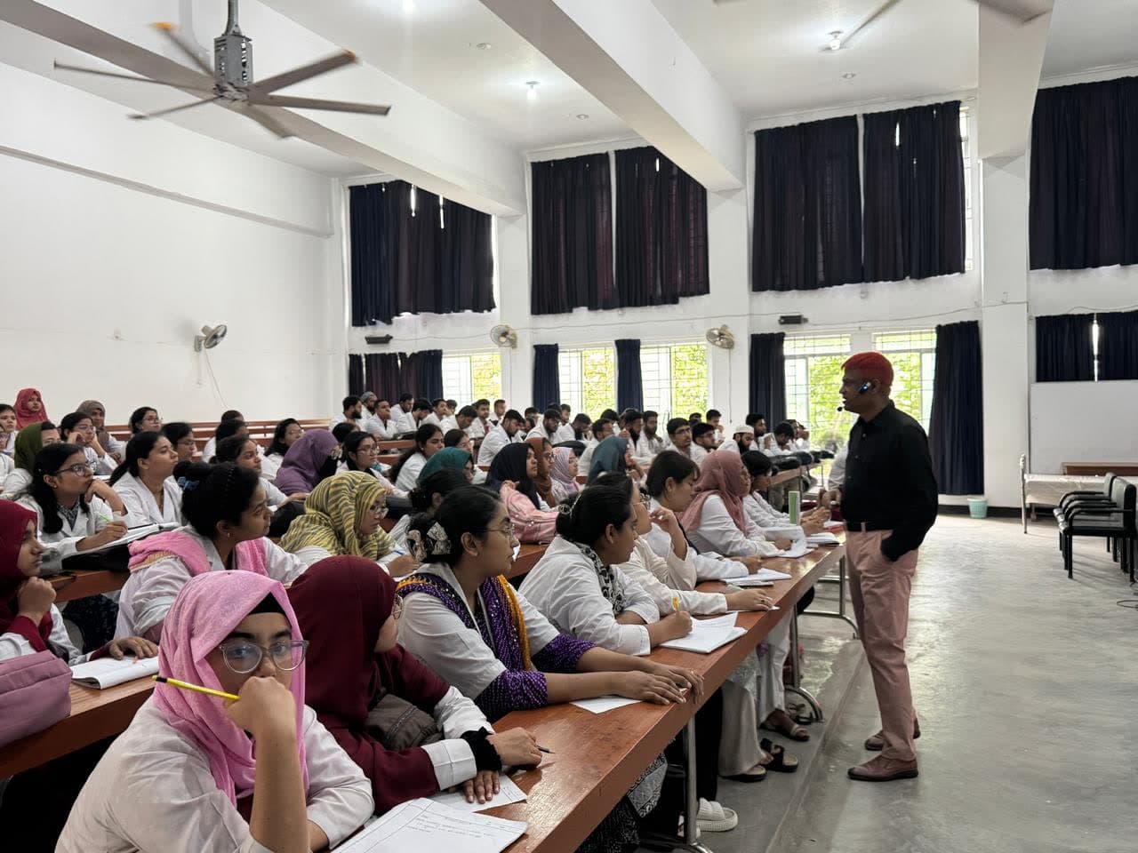 Dr. Md. Shariful Islam teaching a large class of medical students