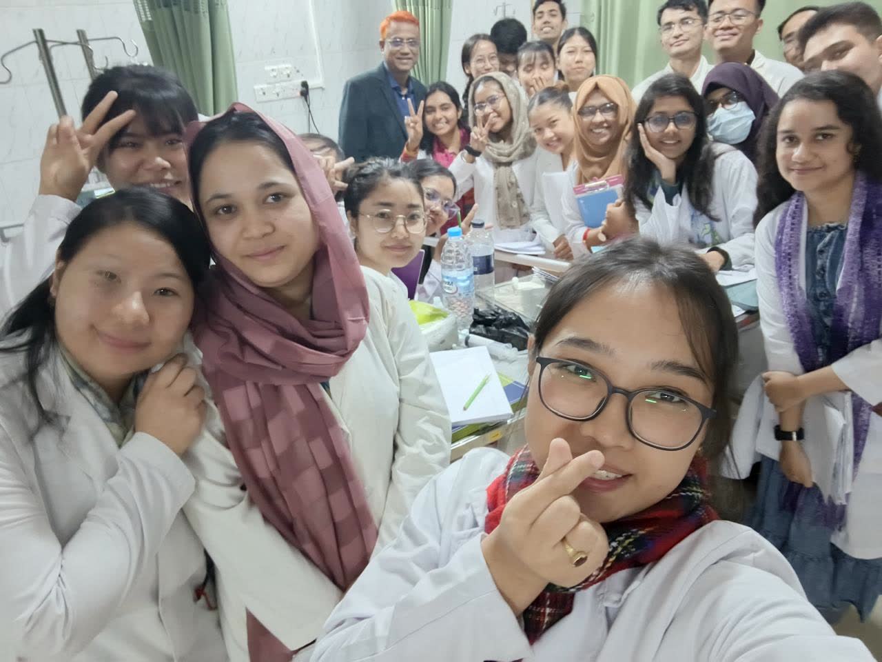 Dr. Md. Shariful Islam with medical students following a teaching session