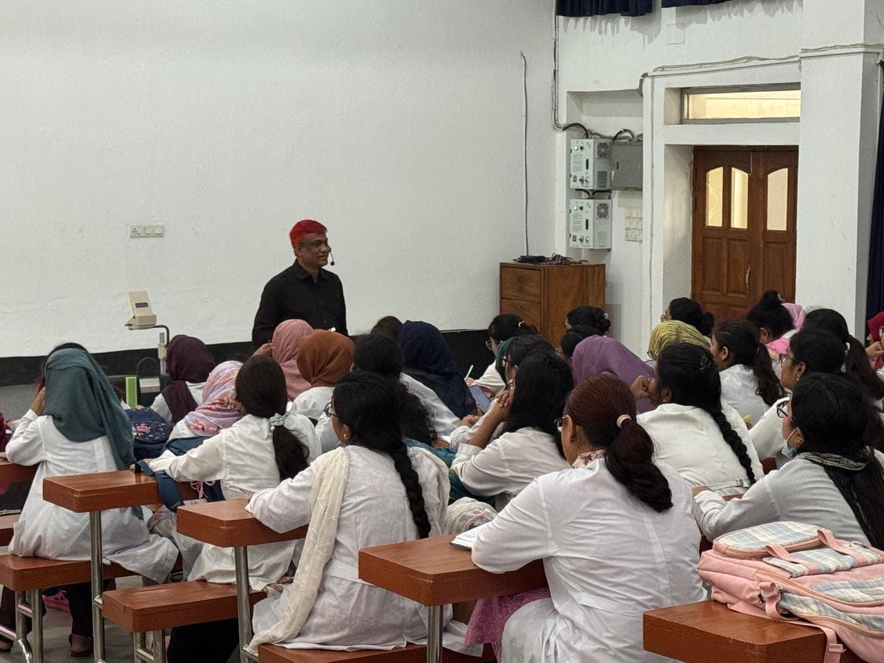 Dr. Md. Shariful Islam teaching medical students in a lecture hall