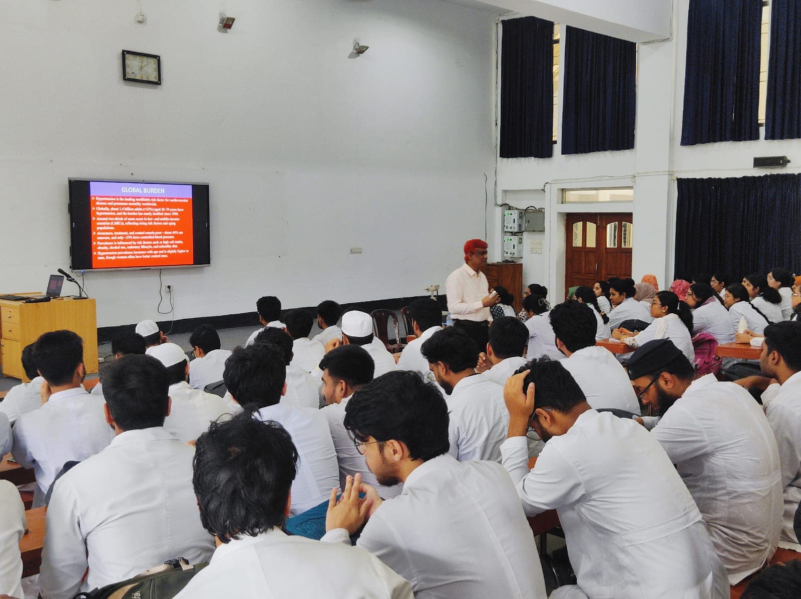 Dr. Md. Shariful Islam teaching medical students in a lecture hall